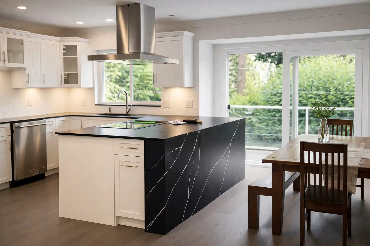 Kitchen renovation cost North Vancouver - open concept black island white cabinets by Arani Construction